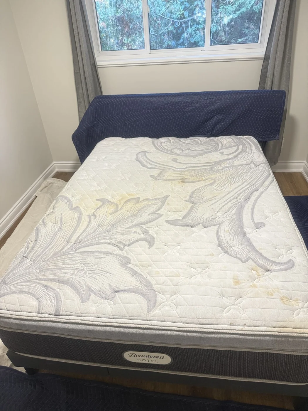 Mattress before cleaning with visible yellow stains
